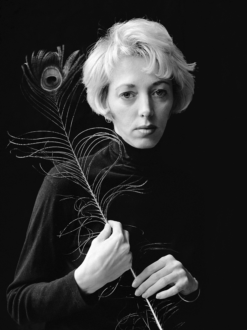 Woman with peacock feather