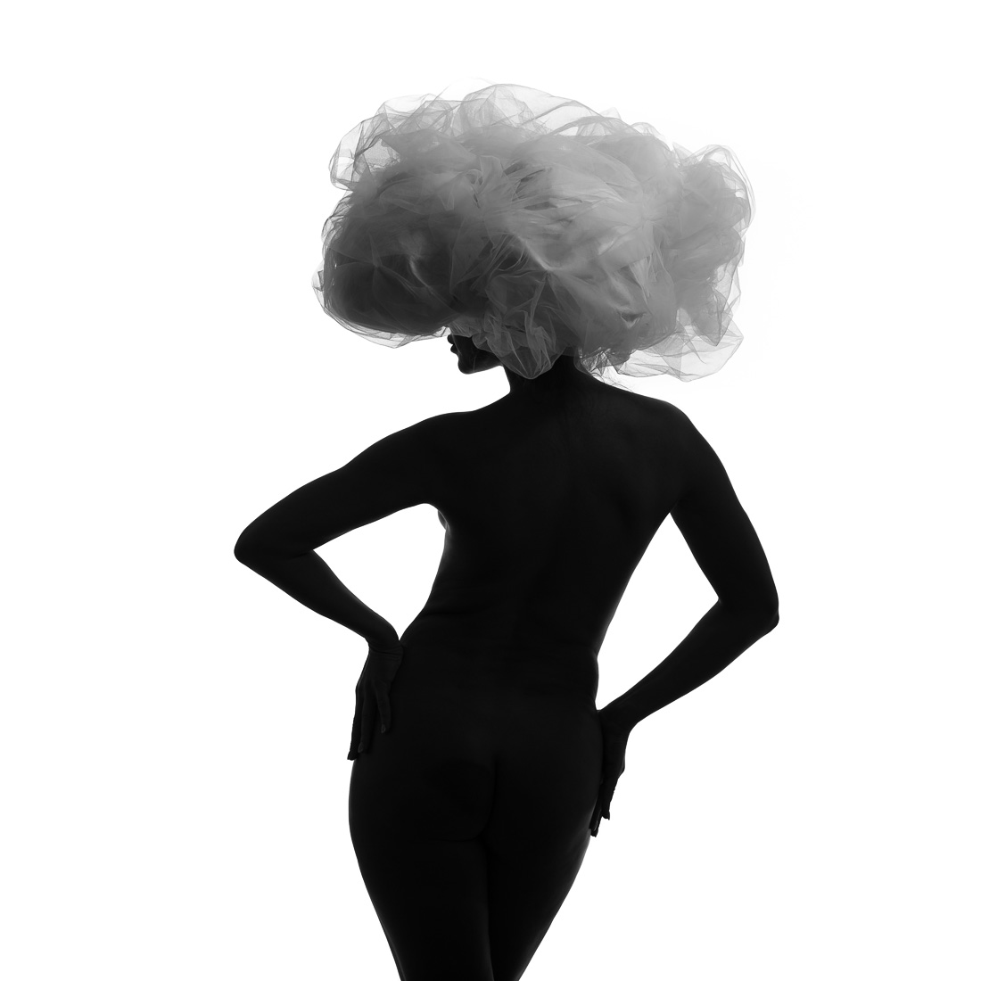 Black model and big white hat.