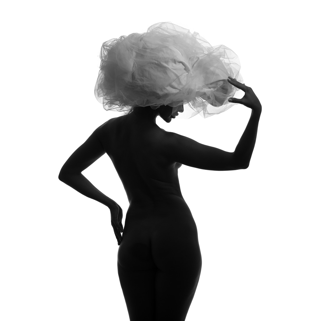 Black model and big white hat.