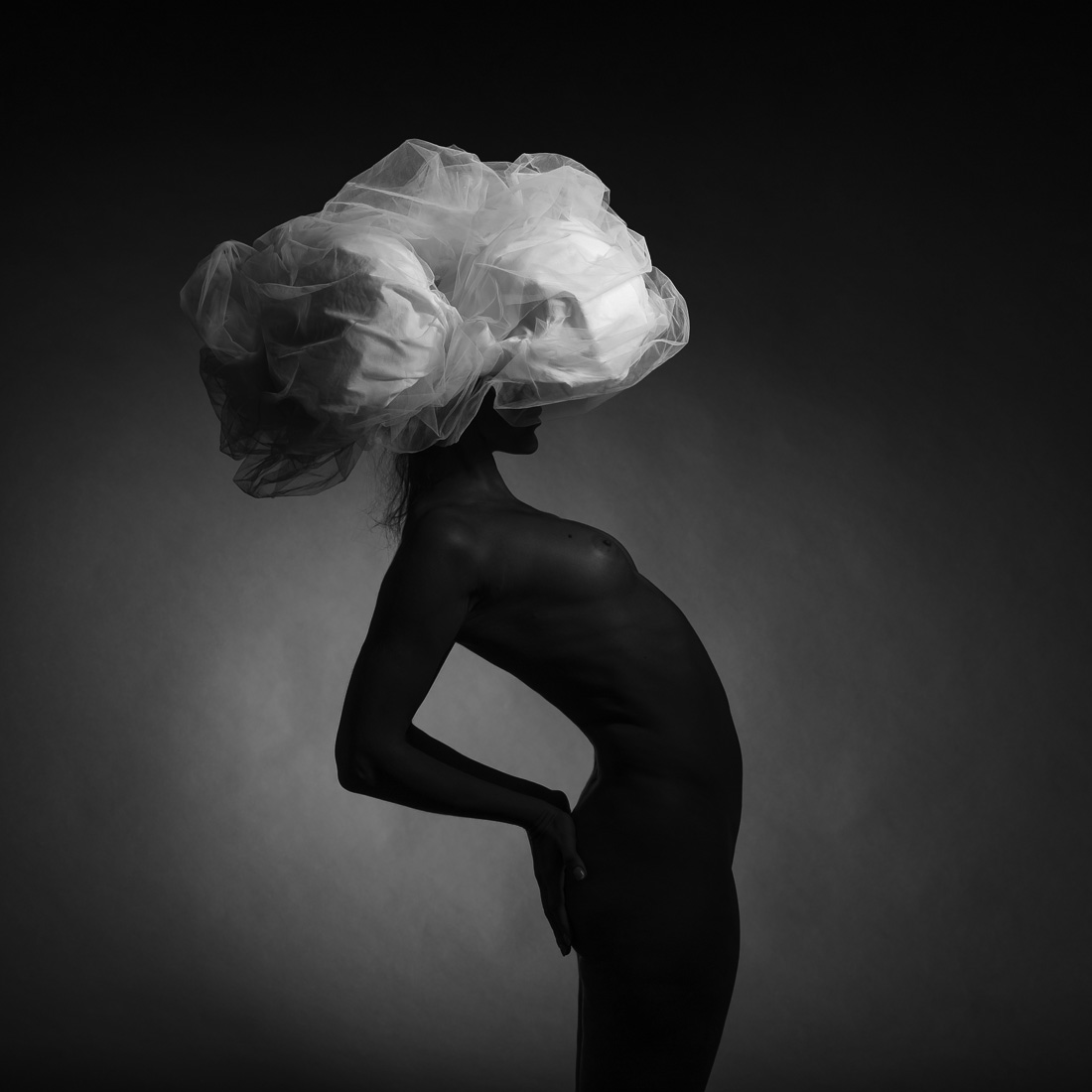 Black model and big white hat.