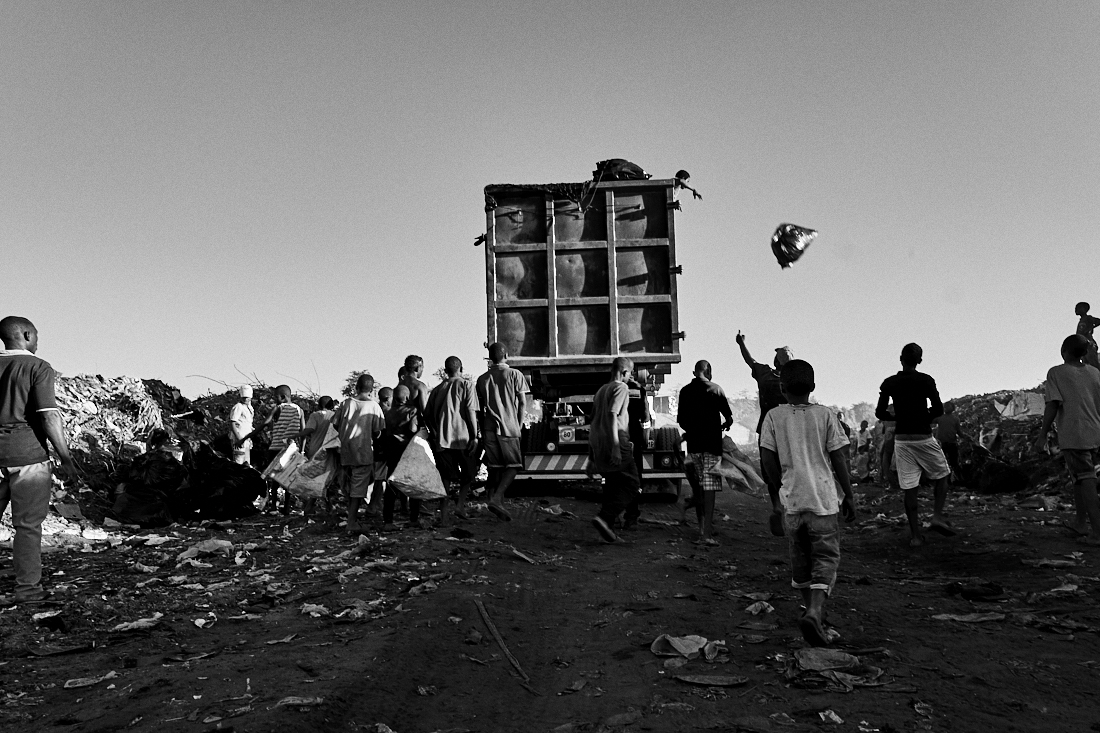 Behind the trash