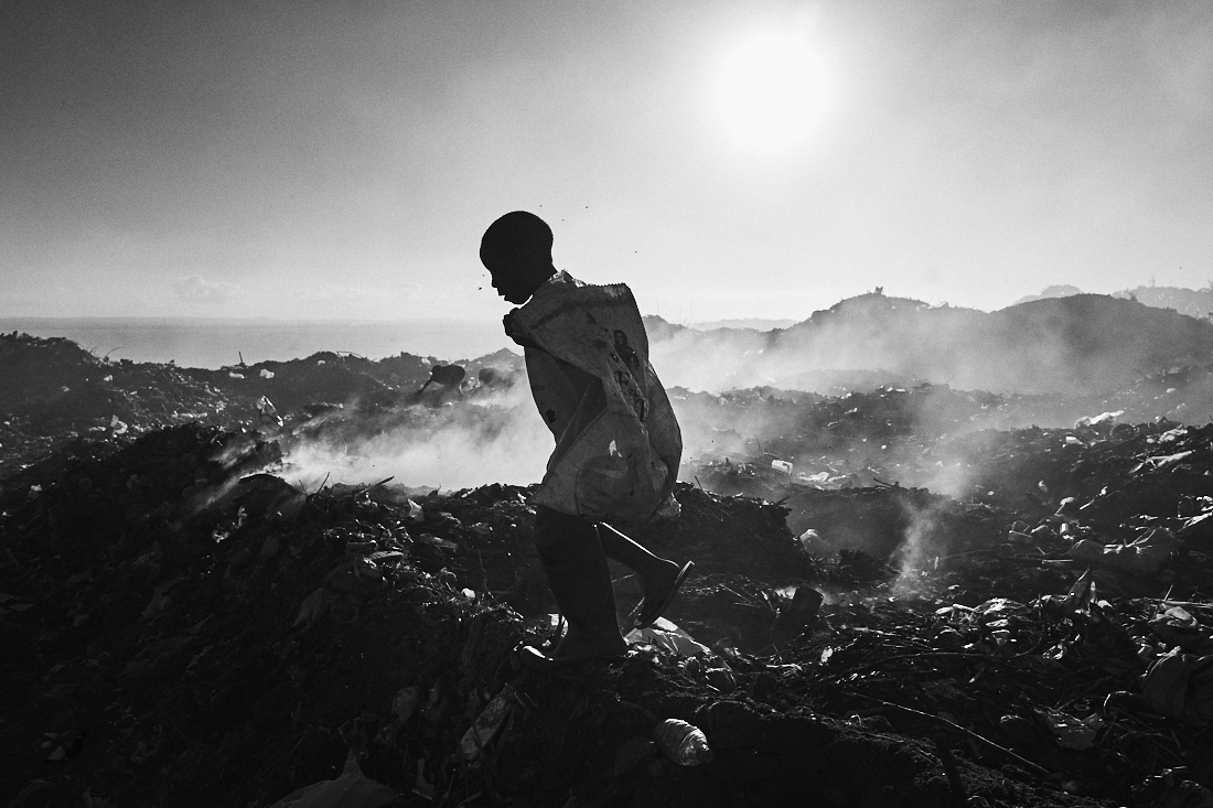 Behind the trash