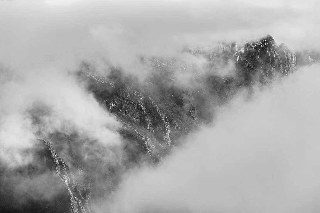 On The Crest Of A Mountain, Behind The Clouds