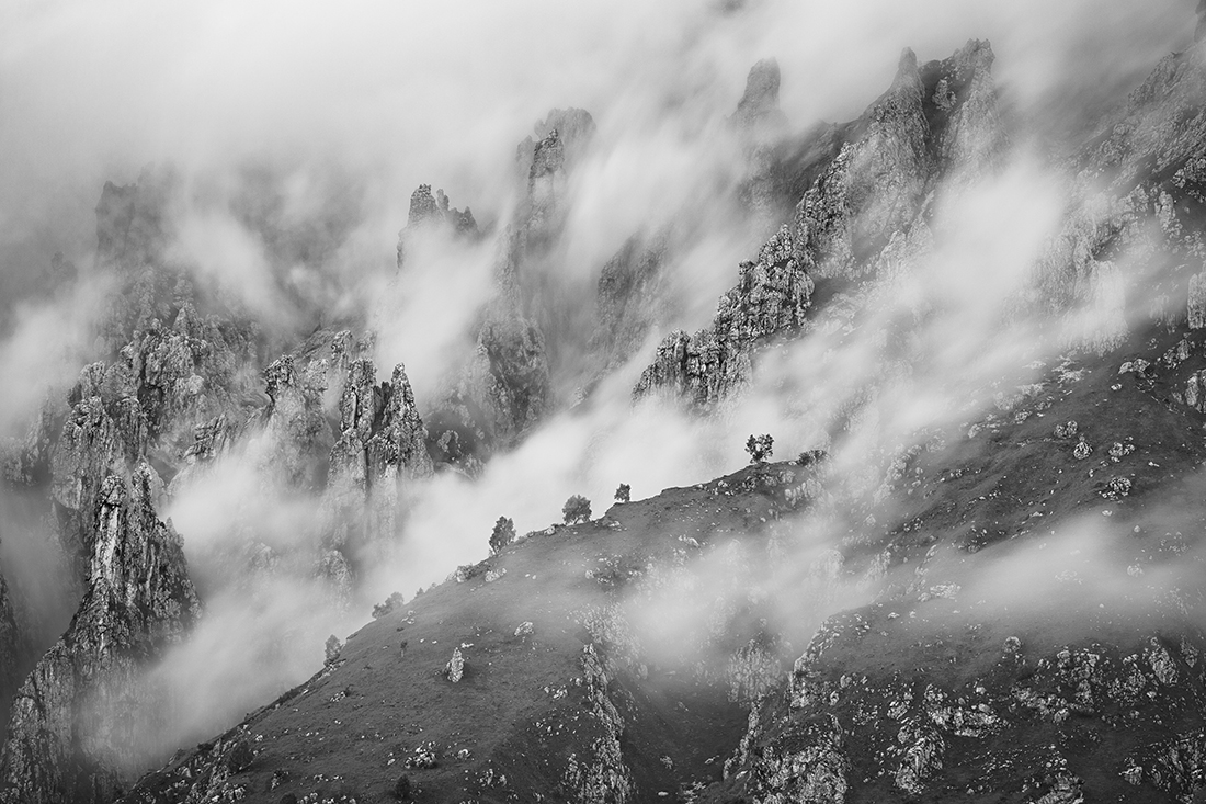 On The Crest Of A Mountain, Behind The Clouds