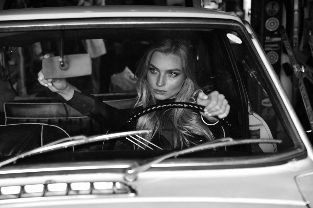 An old MG car and a young Model in love