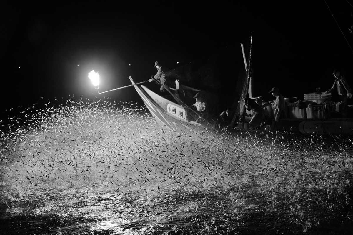 Disappearing fishing boat at night