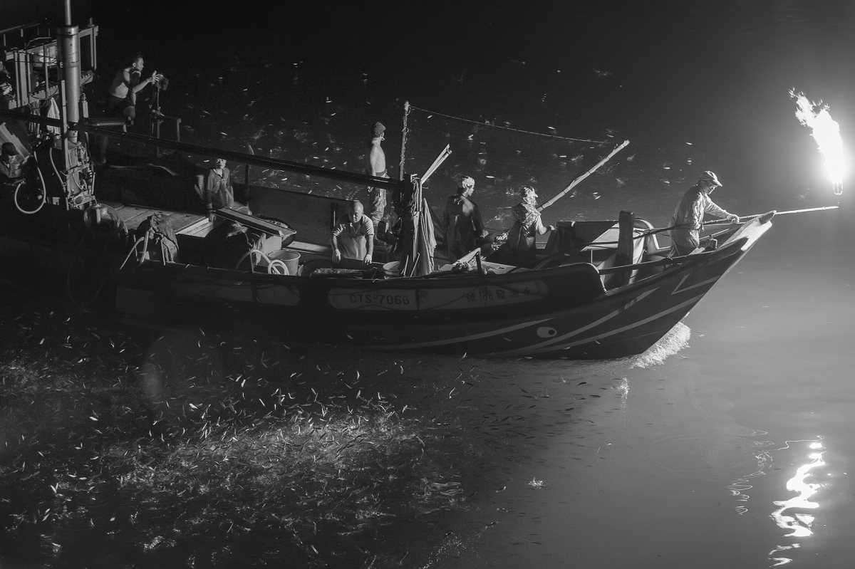 Disappearing fishing boat at night