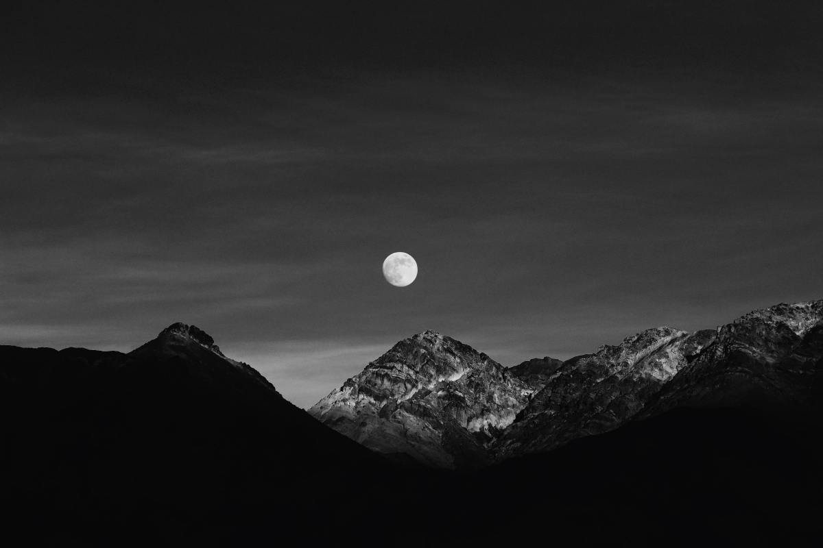 Dusk's Embrace: Moonrise Over the Mountain