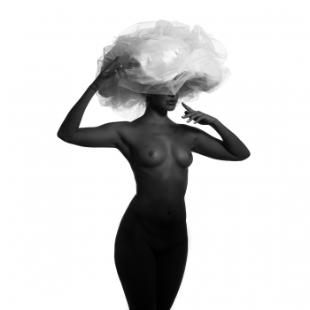 Black model and big white hat.