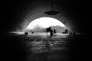 Pianist Playing in the Cave